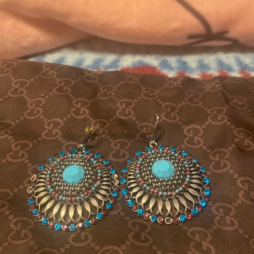 Earrings, silver with various colours, and lite blue stones.